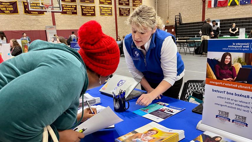 student signing sheet for recruiter at job fair