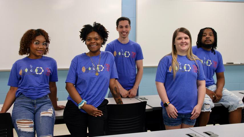 STEM Starter Academy students in front of a classroom